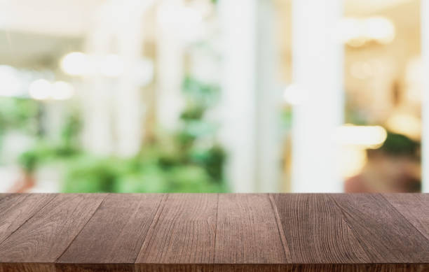 istock Wood Table Top in Blur Background room interior with empty copy space. 1279646250