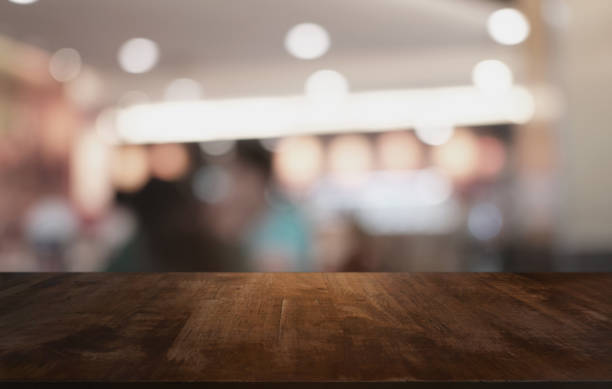 istock Wood Table Top in Blur Background room interior with empty copy space. 1279646608
