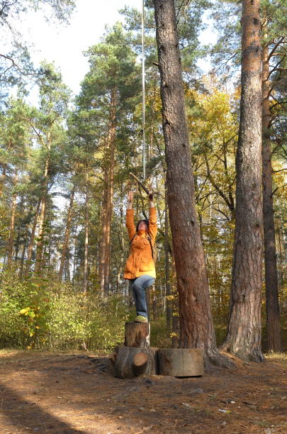 istock Woman is trying to catch a rope swing 1279648719