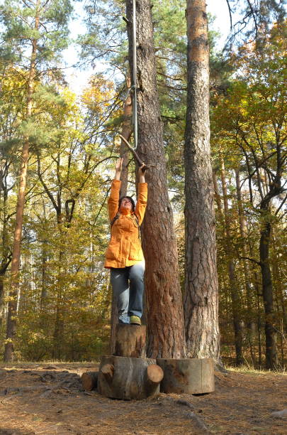 istock Woman is trying to catch a rope swing 1279648730