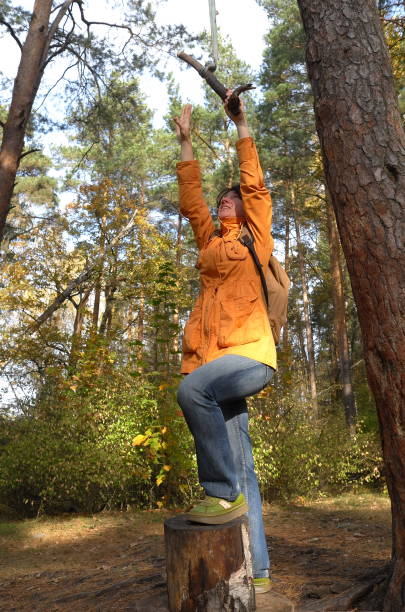 istock Woman is trying to catch a rope swing 1279648771