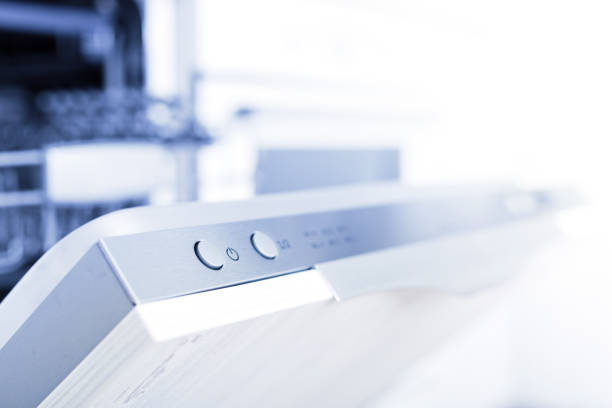 Empty dishwasher with opened door, home appliance dishwashing machine in kitchen interior, no people