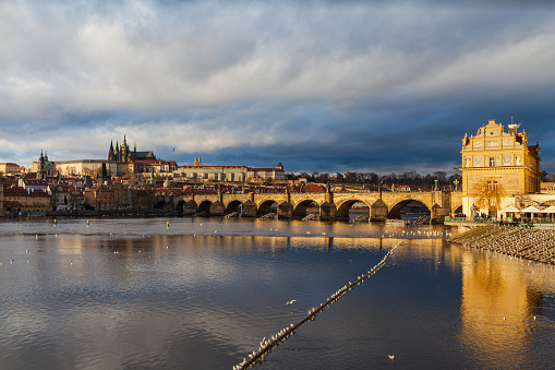 Panorama view of Prague Castle and St. Vitus Cathedral in Mala Strana old district with Charles Bridge, Bedrich Smetana museum on Vltava river of Prague with beautiful winter sunshine, Czech Republic