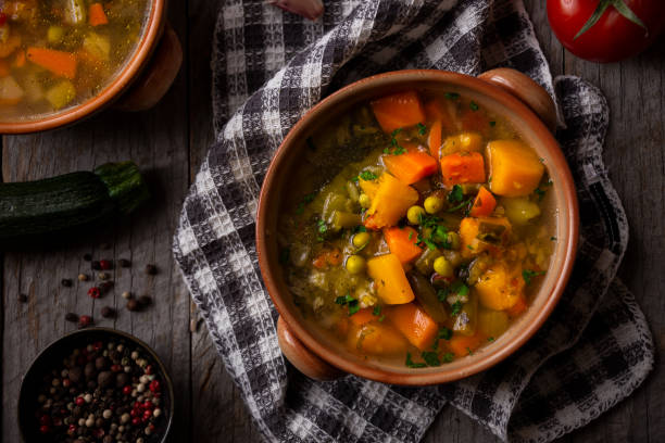 istock Vegetable soup with parsley on dark background 1279652757
