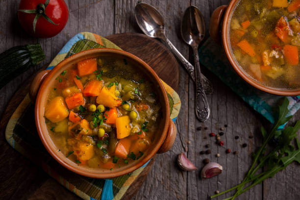 istock Vegetable soup with parsley on dark background 1279652823