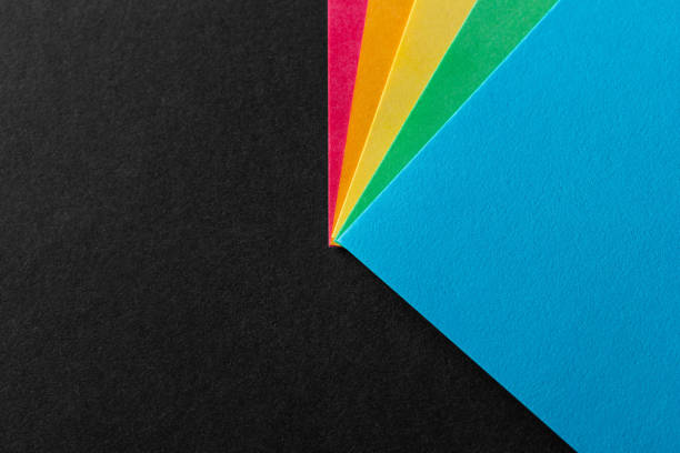 istock Colored rainbow paper corners on black textured background. Business concept. Layout for design. Copy space 1279656865