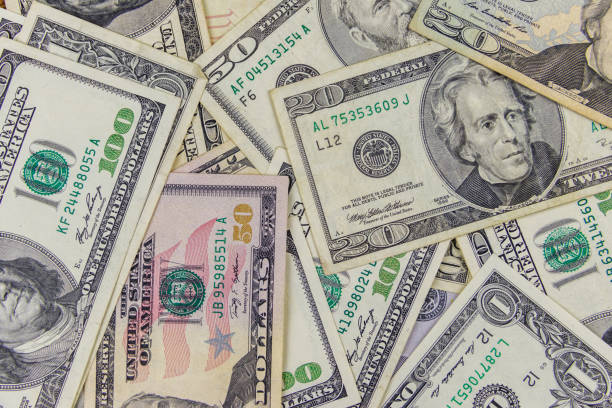 istock Background of different us dollar banknotes 1279660453
