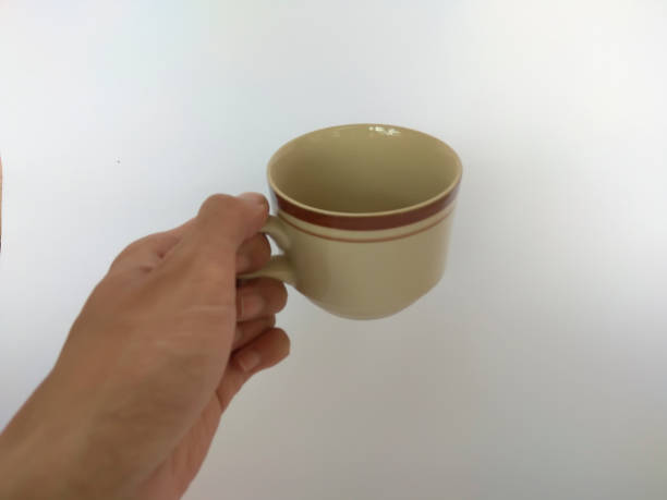 istock a man's hand is holding a cup made of ceramic 1279661477