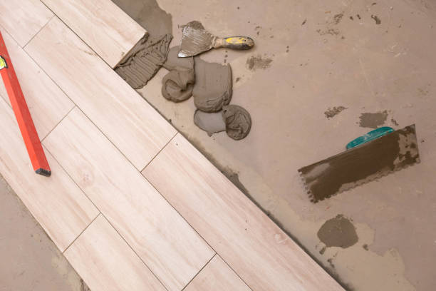 istock Stainless steel notched trowel - as the basic tool for distributing glue under ceramic tiles on any construction site. 1279664324