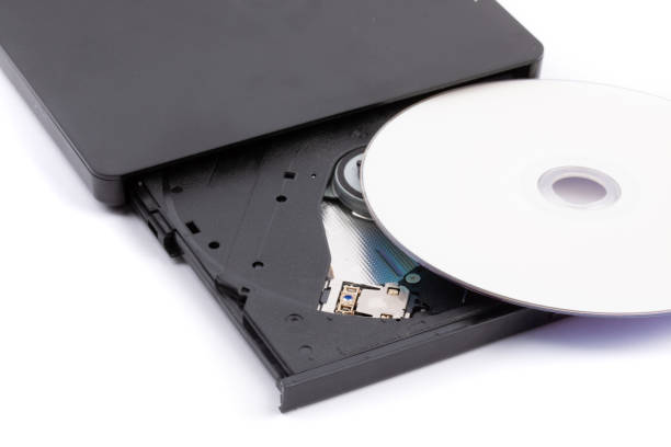 istock closeup of an open external computer DVD CD drive with a white DVD disk ready to insert 1279666499