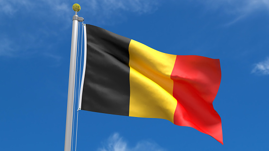 Belgium Flag Waving, fluttering against the background of the blue sky with silver pole