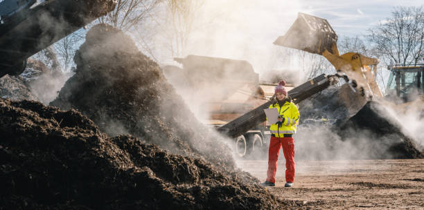 istock Woman worker with clipboard in industrial compost plant 1279672700
