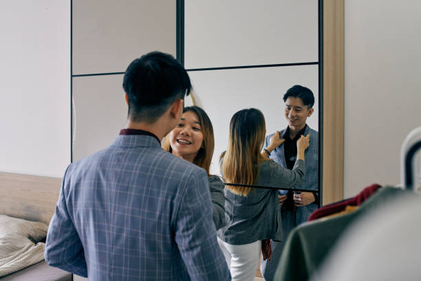 istock Young Chinese Couple Getting Ready Together for Work 1279673609