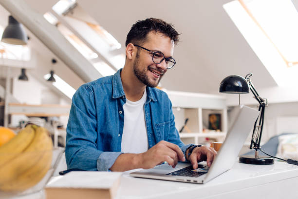 istock Young man shopping online from home 1279676483