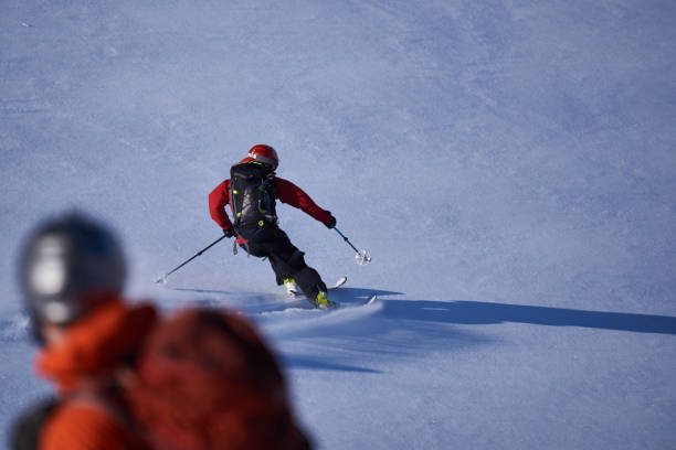 istock Watching a back country skier skiing first track. 1279676526