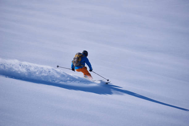 istock Back country skier skiing first track in powder snow. 1279676566