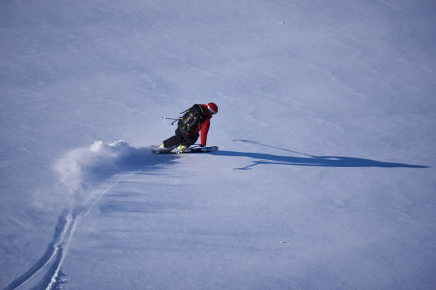 istock Back country skier skiing first track in powder snow. 1279676613