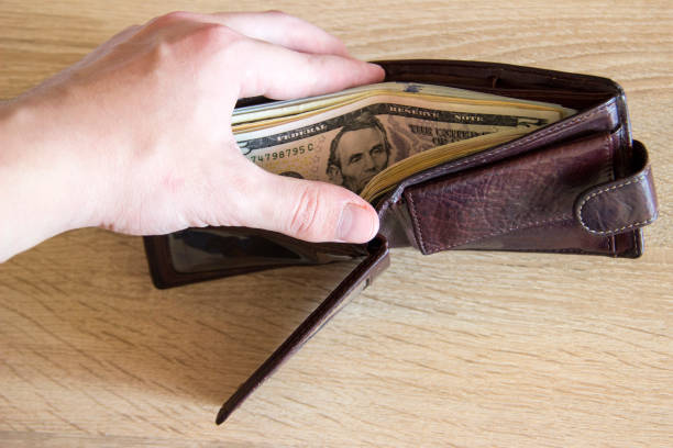 istock Man showing wallet to camera with money. 1279680332