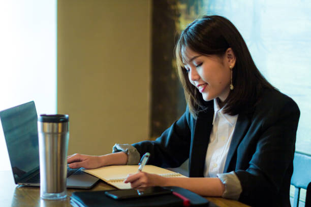 istock Young woman doing her work in a cafe 1279681304