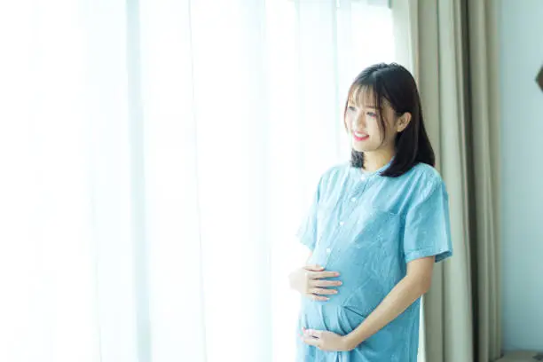 Photo of portrait of pregnant woman ready a new life