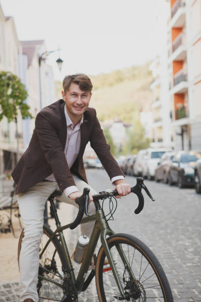 istock Mature man cycling at the city 1279683748