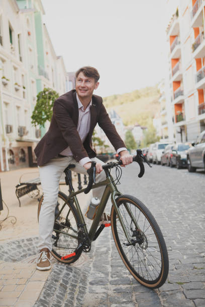 istock Mature man cycling at the city 1279683887
