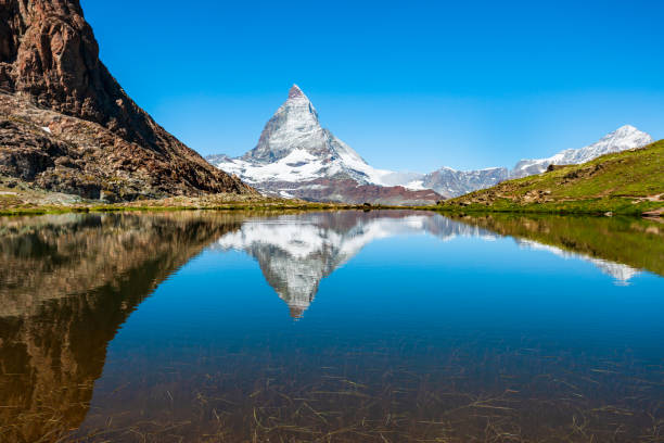 istock Riffelsee lake and Matterhorn, Switzerland 1279684011