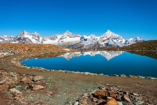 istock Riffelsee lake and Matterhorn, Switzerland 1279684021