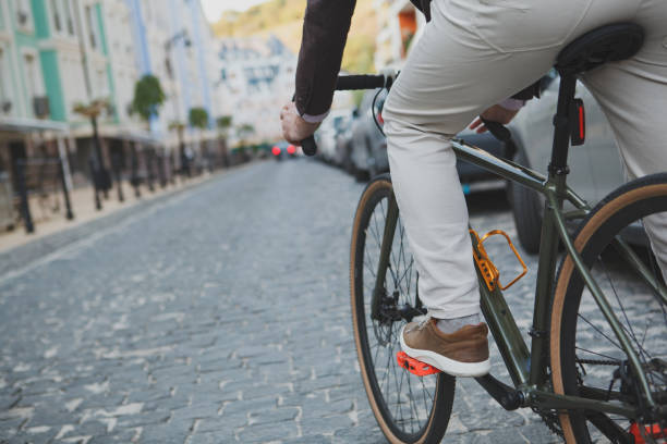 istock Mature man cycling at the city 1279684413