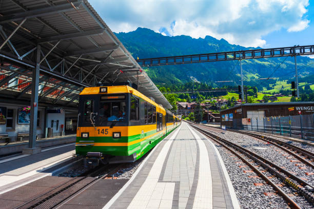 train at wengen station, switzerland - interlaken railroad station train rural scene imagens e fotografias de stock