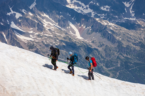 CHAMONIX, FRANCE - JULY 18, 2019: Unidentified climbers going to the Mont Blanc or Monte Bianco mountain, the highest mountain in the Alps and in Europe