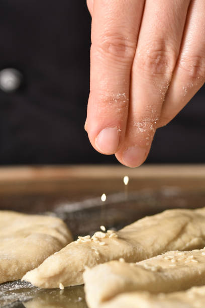 istock Sesame seeds sprinkling close-up 1279690722