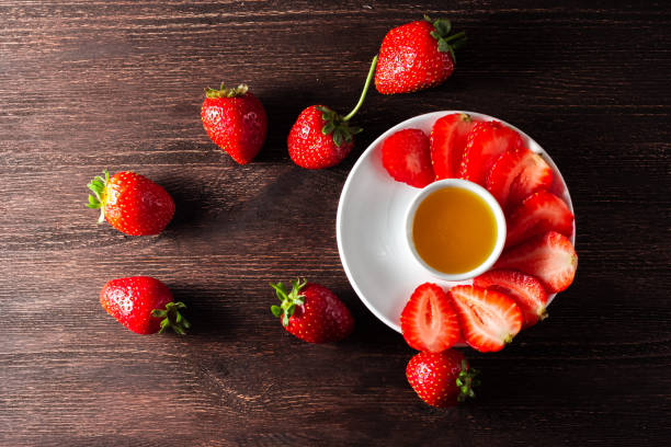 istock whole and finely chopped strawberries with honey 1279692015