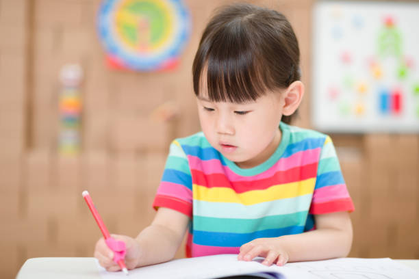 istock young girl practice drawing different shapes for home schooling 1279694237