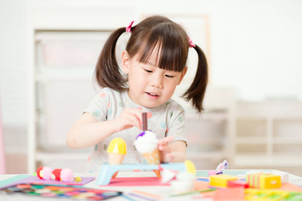 istock young girl decorating handmade craft for home schooling 1279694342