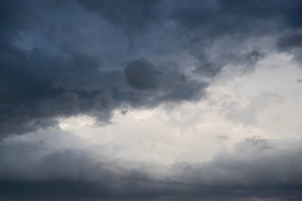 istock Dramatic gray clouds in the sky. Gray and white cloudy sky 1279695977