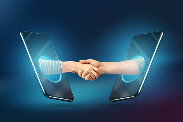 istock People shaking hands through smartphone screens, concluding a contract via the Internet. Concept for online business agreement, job well done 1279696032
