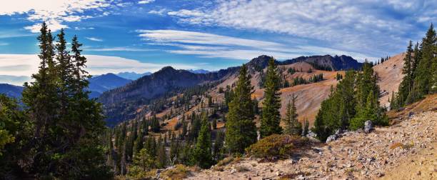 istock Sunset Peak hiking trail views towards Devil’s Castle Sugarloaf Mountain at Alta Resort on Great Western Trail in Rocky Wasatch Front Mountains, Midway and Heber, Utah. United States. 1279696049