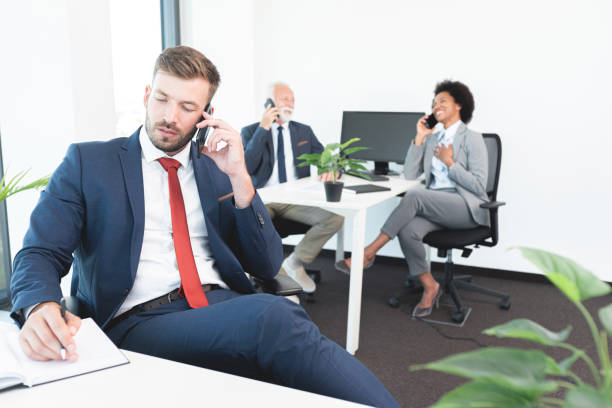istock Three business people on phone call 1279697137