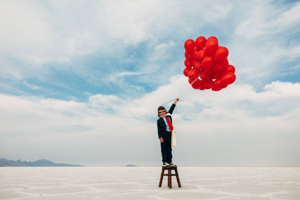 istock Young Business Boy with Balloons 1279699044