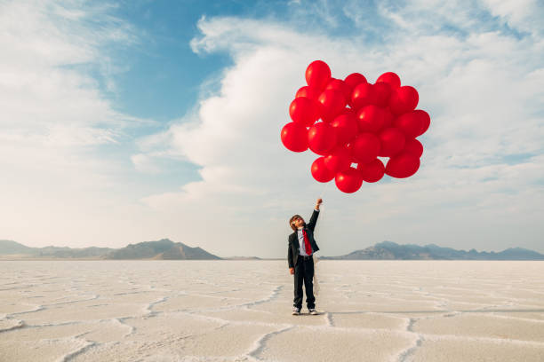 istock Young Business Boy with Balloons 1279699050