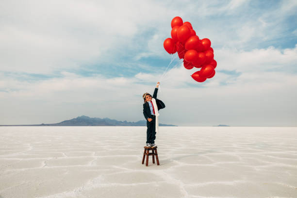 istock Young Business Boy with Balloons 1279699053