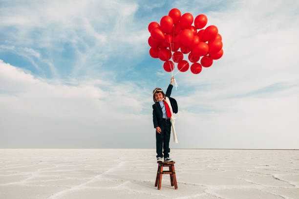 istock Young Business Boy with Balloons 1279699059