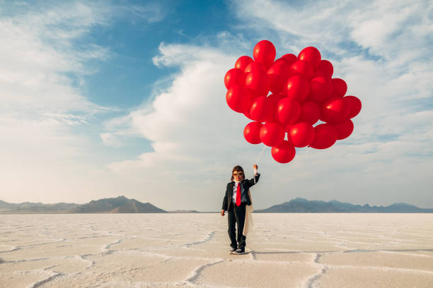 istock Young Business Boy with Balloons 1279699060