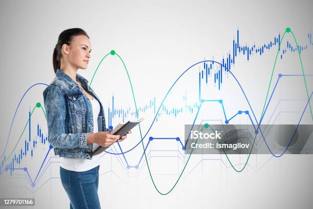 Woman With Notebook Financial Graphs Stock Photo - Download Image Now - Adult, Analyzing, Beautiful People