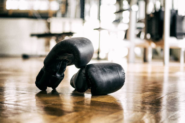 istock Boxing glove on the floor in gym 1279701327