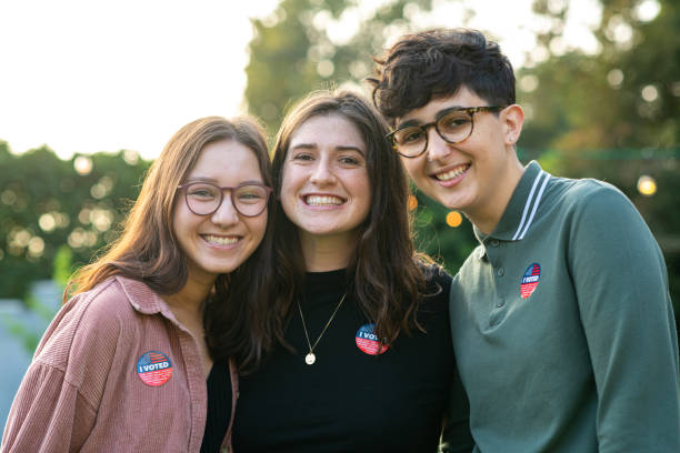 millennials wearing the i voted stickers - jovens a votar imagens e fotografias de stock