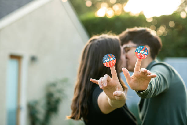 istock Two Women Kiss After Voting 1279703700