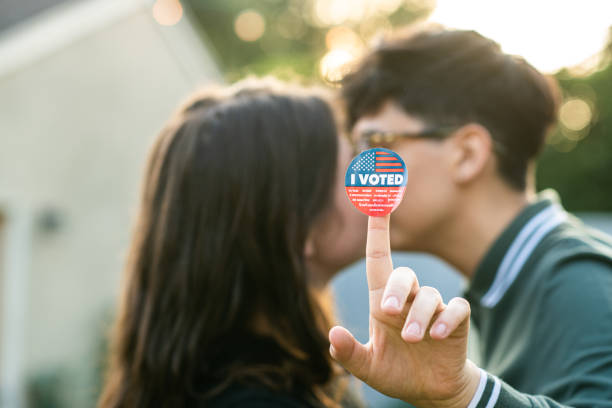 istock Two Women Kiss After Voting 1279703703