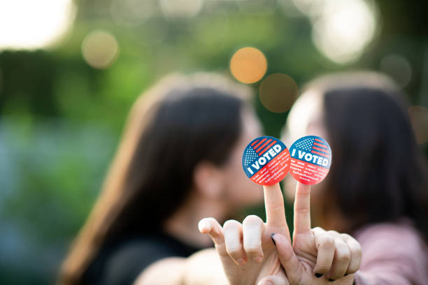 istock Two Women Kiss After Voting 1279703712